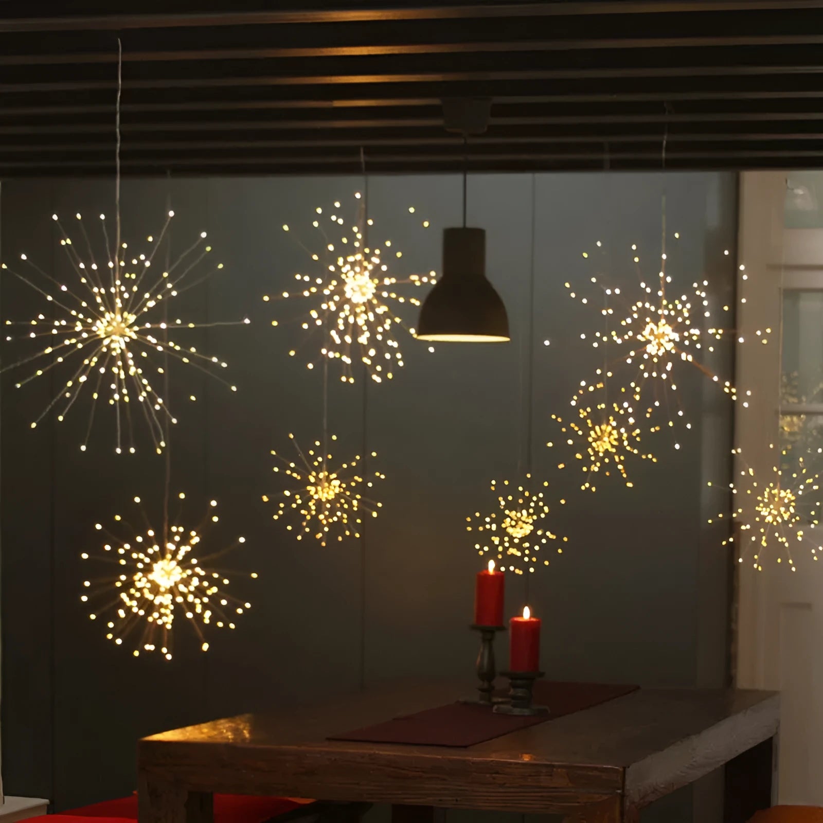 Solar-powered LED firework effect decorative hanging light with remote control for outdoor use.