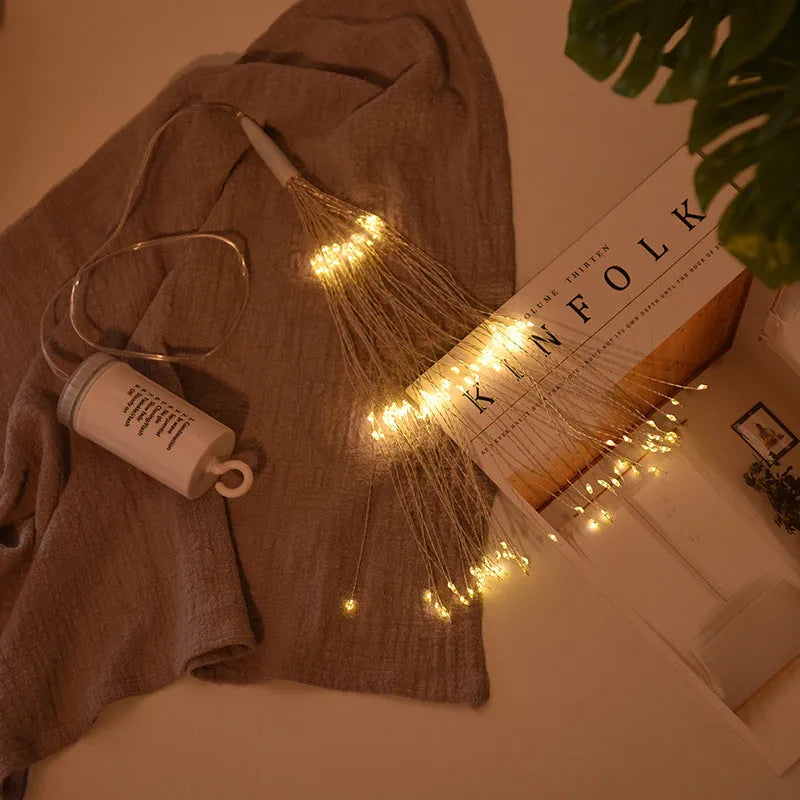 Solar-powered LED firework effect decorative hanging light with remote control for outdoor use.