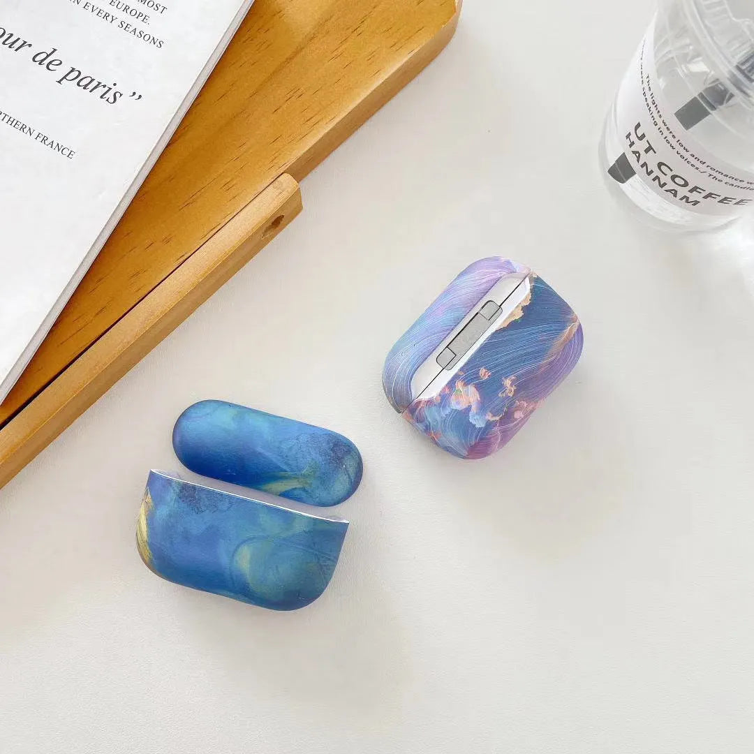 Pink and blue watercolour design hard plastic protective sleeve for Apple AirPods Pro and AirPods 1/2 charging case.