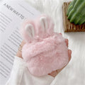 Pink rabbit ear silicone protective cover on Apple AirPods case