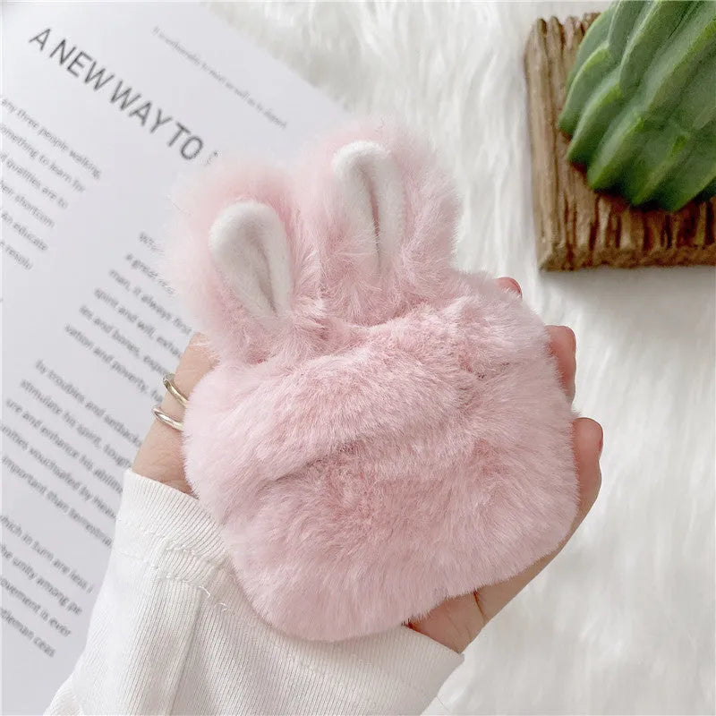 Pink rabbit ear silicone protective cover on Apple AirPods case
