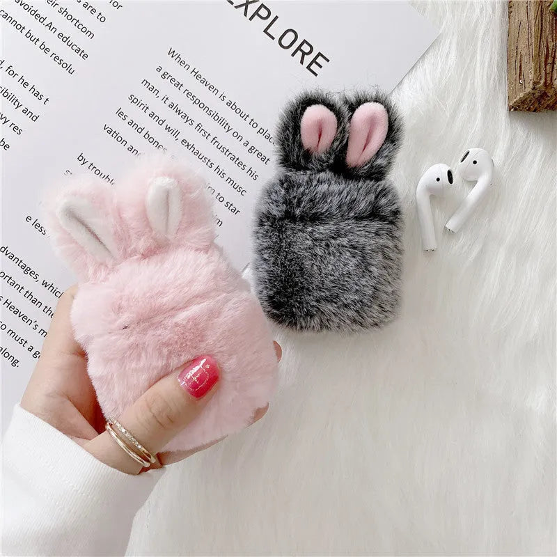 Pink rabbit ear silicone protective cover on Apple AirPods case