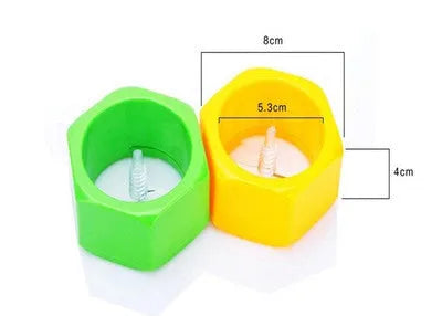 Yellow and green plastic spiral knife vegetable cutter for slicing cucumbers, 8 cm diameter.