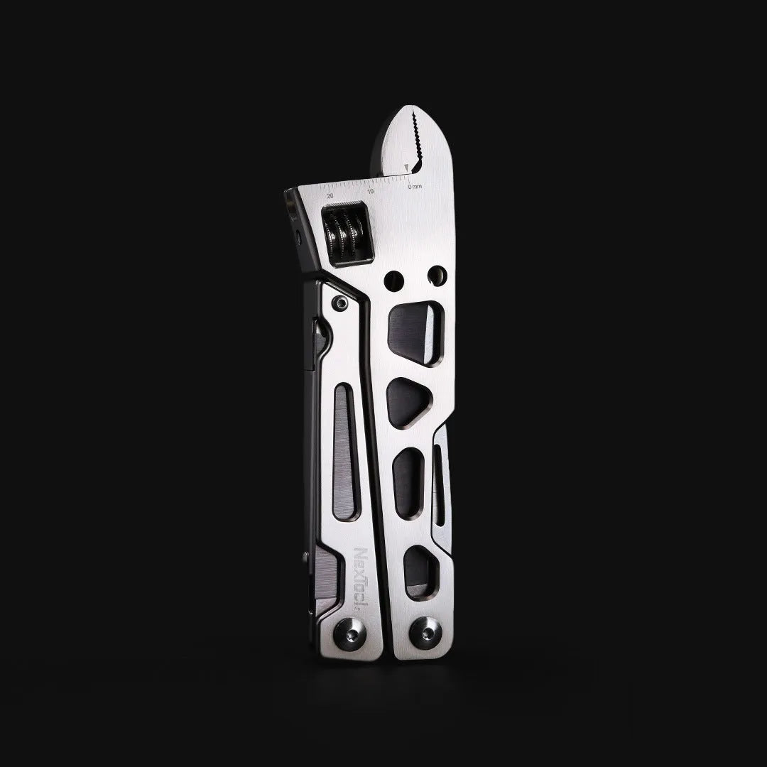 White stainless steel multi-function tool with wrench, knife and needle nose pliers measuring 13cm