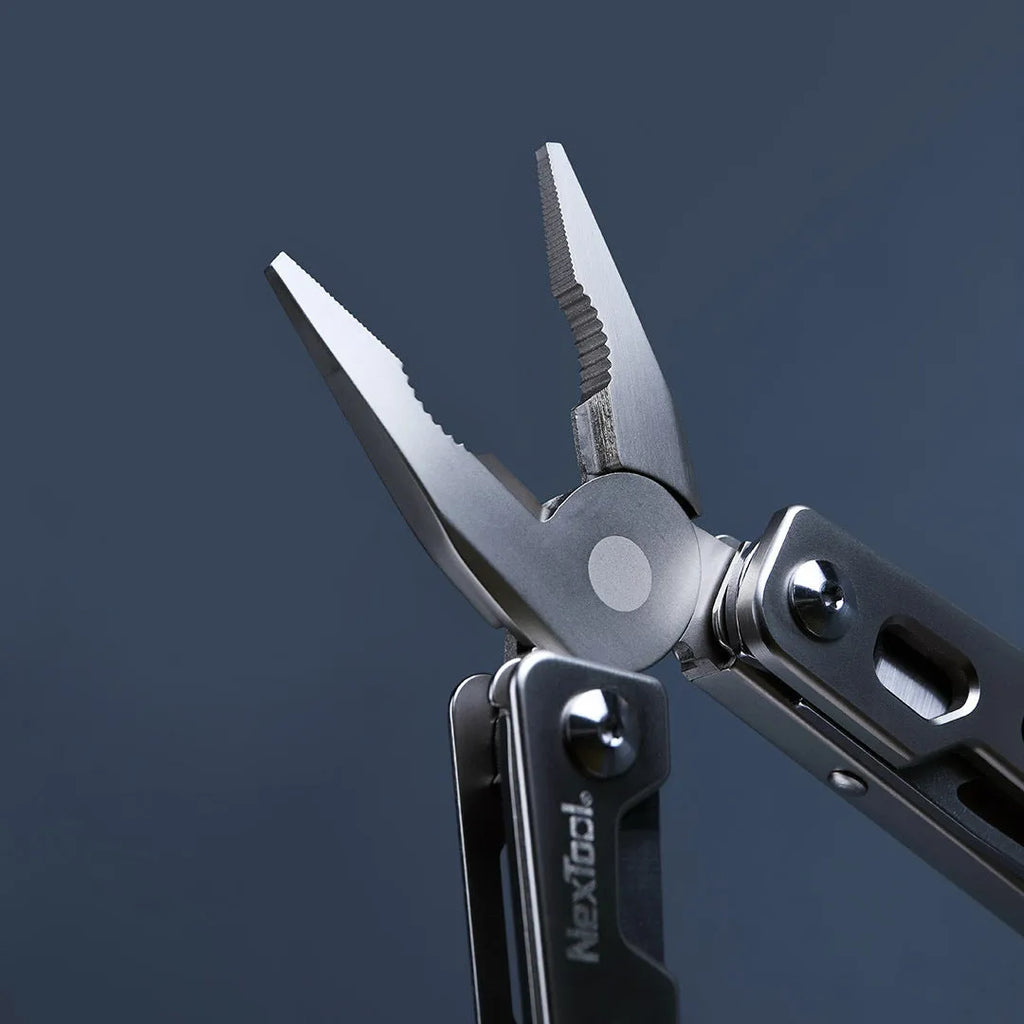 White stainless steel multi-function tool with wrench, knife and needle nose pliers measuring 13cm