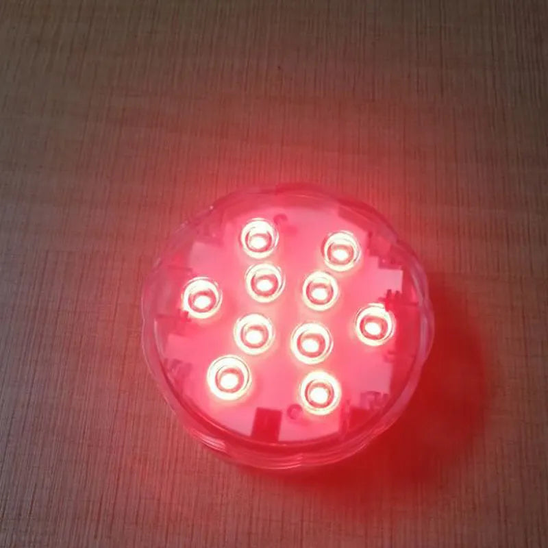 White disc-shaped waterproof LED light with remote control for garden and pool decoration