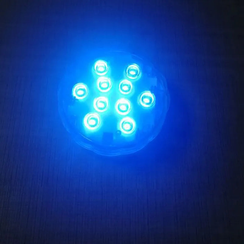 White disc-shaped waterproof LED light with remote control for garden and pool decoration