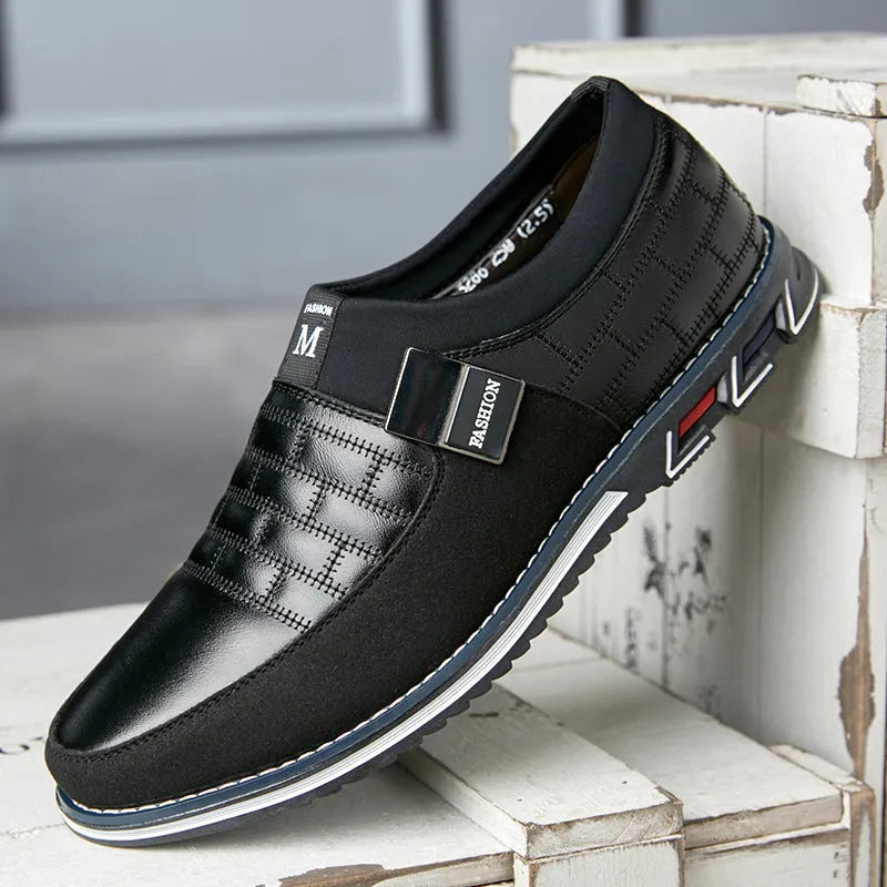 Men's large size black leather casual low-top shoes on a white background.