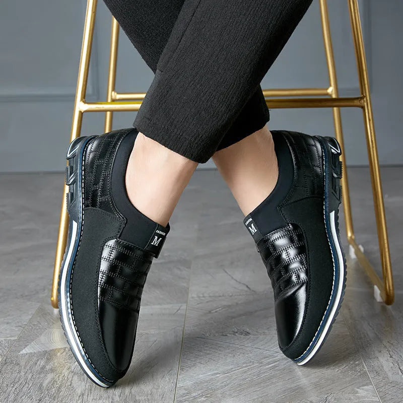 Men's large size black leather casual low-top shoes on a white background.