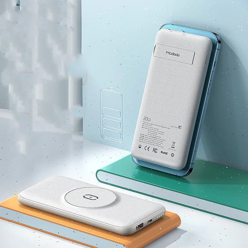 Maiduo Magsafe magnetic wireless power bank in mint green, showing back clip and compact size next to an iPhone.