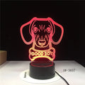 Colour gradient effect LED table lamp with remote control on a wooden surface.