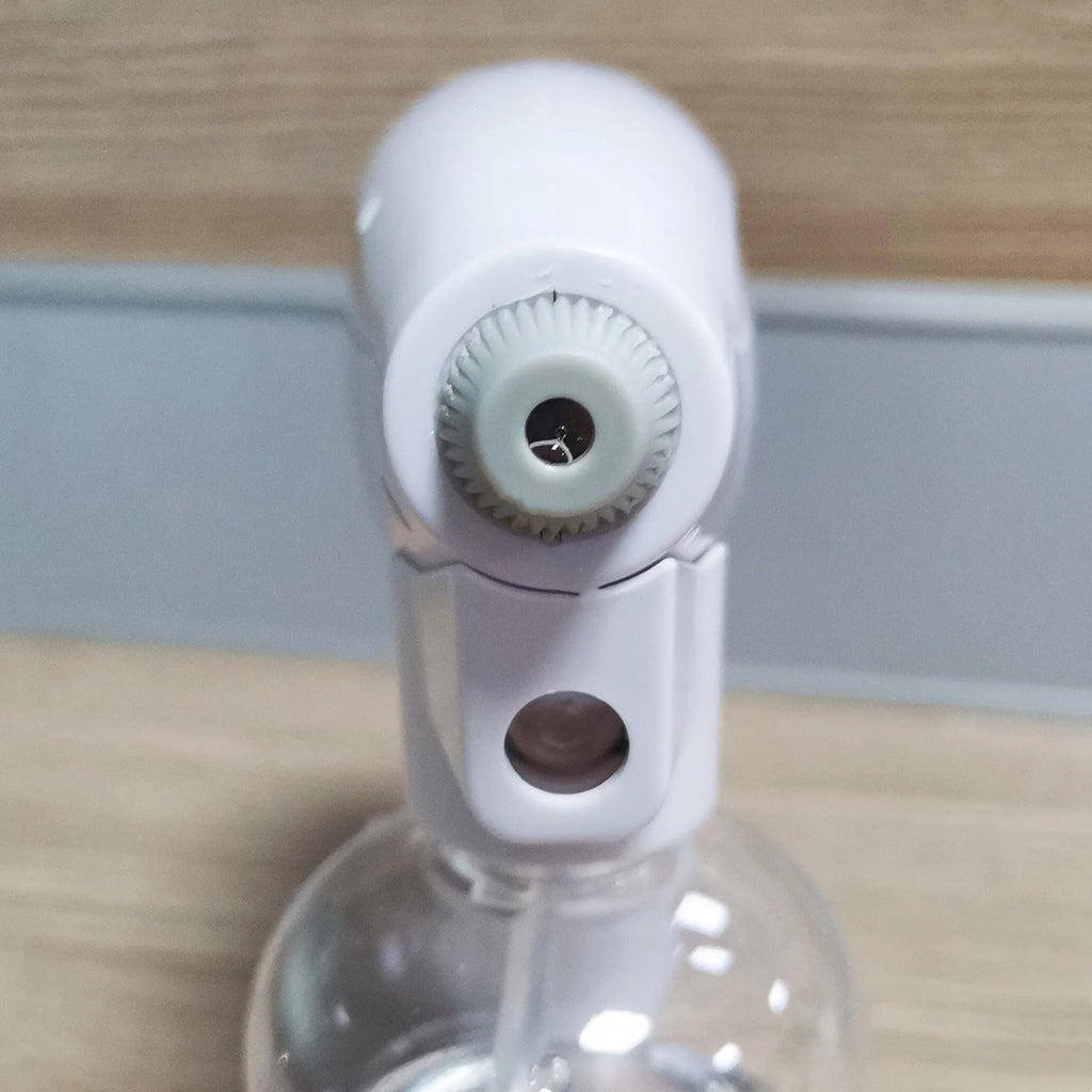 White handheld wireless electric spray gun for disinfection on a plain background.