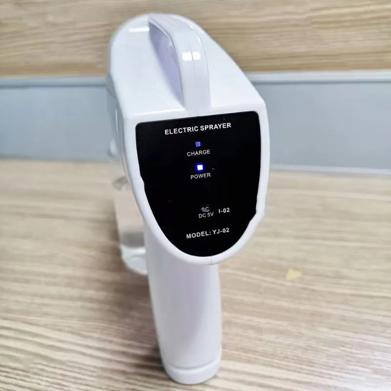 White handheld wireless electric spray gun for disinfection on a plain background.