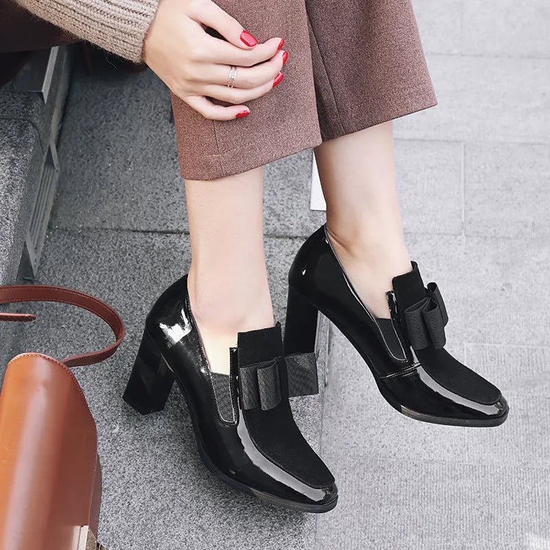Black patent leather women's high heels with a thick heel and square toe
