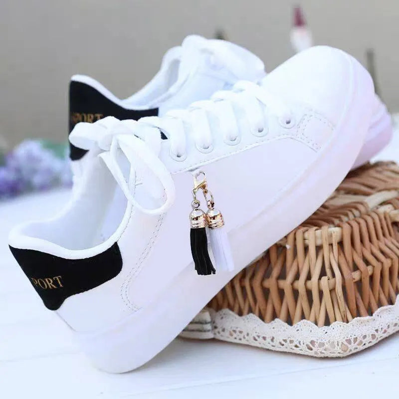 Women's white mesh fashion sneakers with flat rubber sole showing breathable construction
