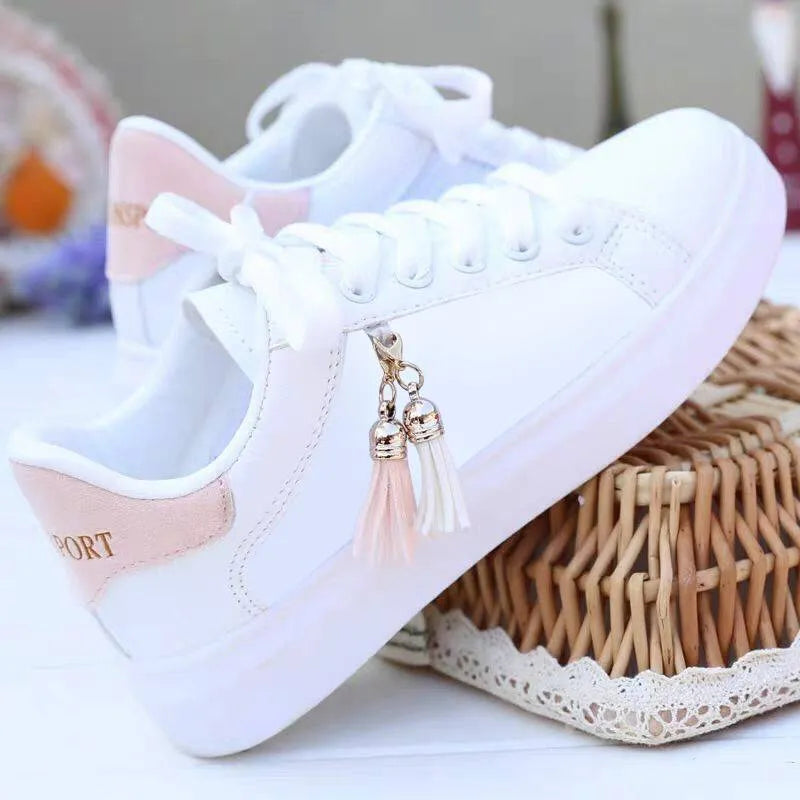 Women's white mesh fashion sneakers with flat rubber sole showing breathable construction