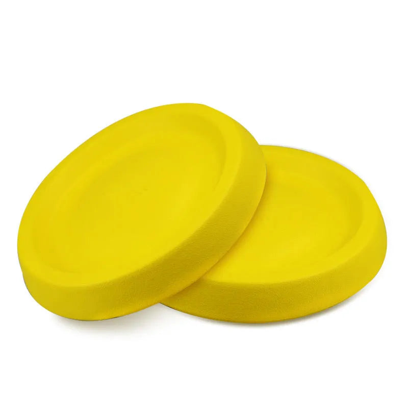 Yellow EVA plastic throwing toy for dogs on green grass