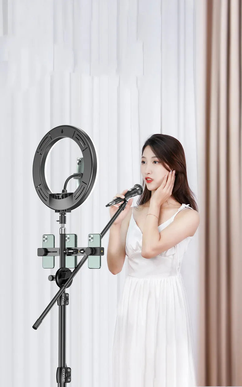 Carbon alloy mobile phone live tripod with mounted ring light and storage bag.