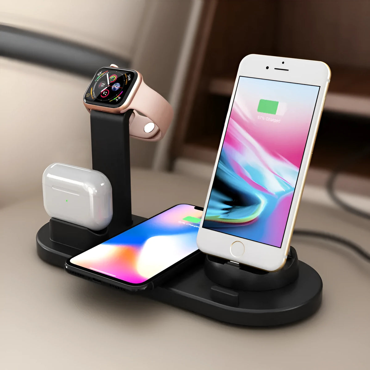 Black three-in-one wireless charging bracket holding a smartwatch, headphones, and an iPhone.