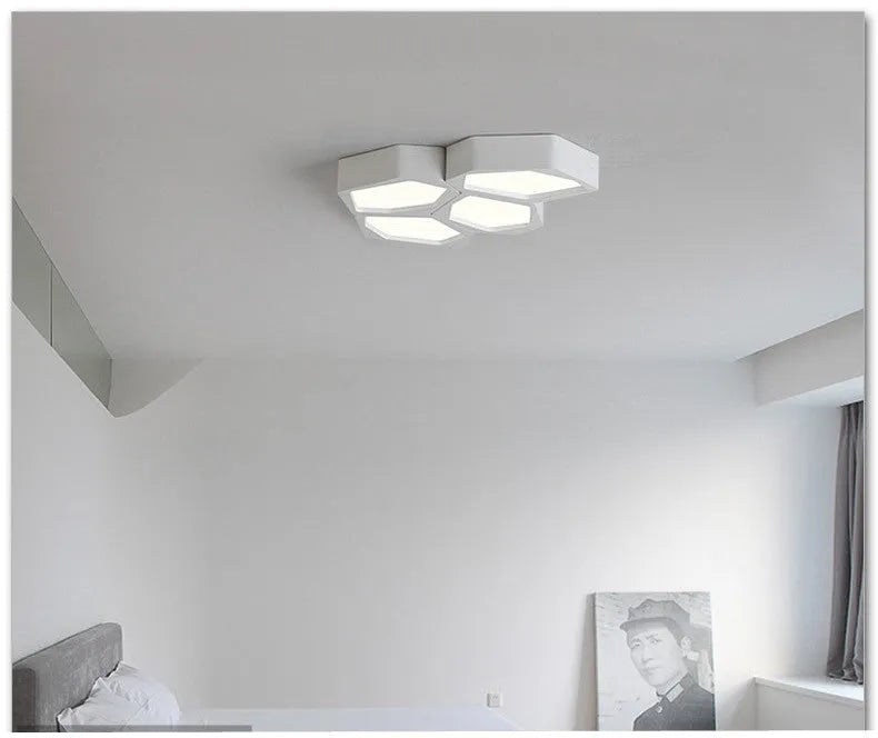 Geometric shaped LED light fixture with iron shade in black or white frame options