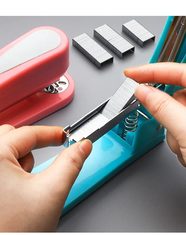 360-degree rotatable desktop stapler shown in dark blue, demonstrating its rotating head and metal nail outlet.