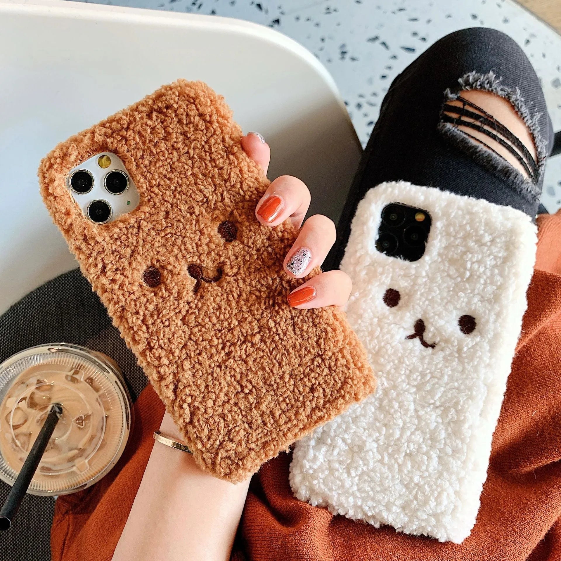 Brown embroidery plush cartoon bear face on a soft TPU iPhone case for iPhone 11.