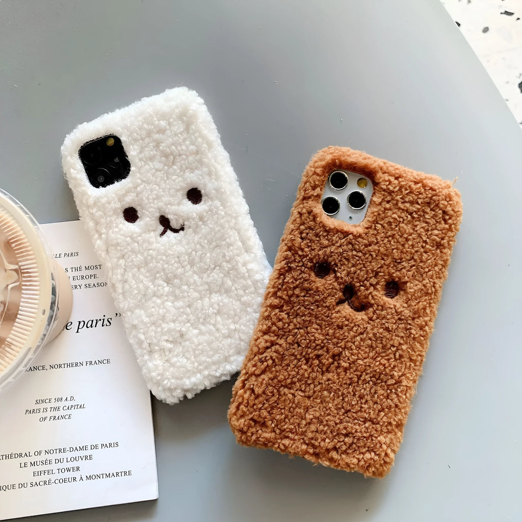 Brown embroidery plush cartoon bear face on a soft TPU iPhone case for iPhone 11.
