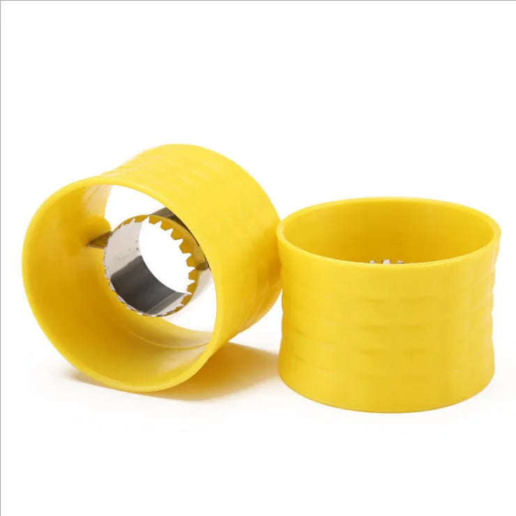 Yellow manual corn grinder thresher tool with corn-shaped design on a kitchen counter.