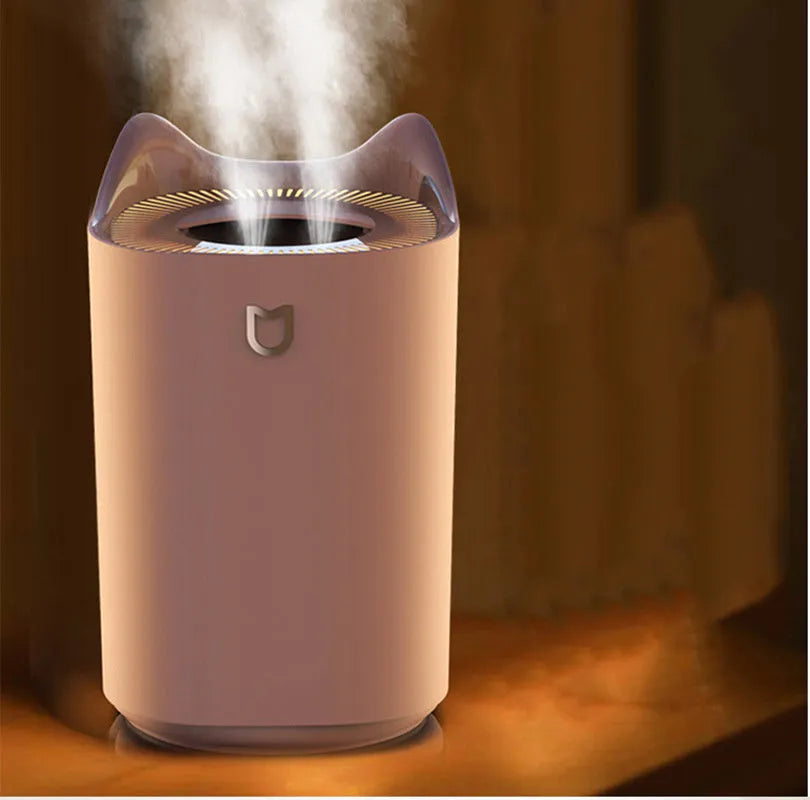Double spray humidifier with three mist outlets in coral pink or white finish