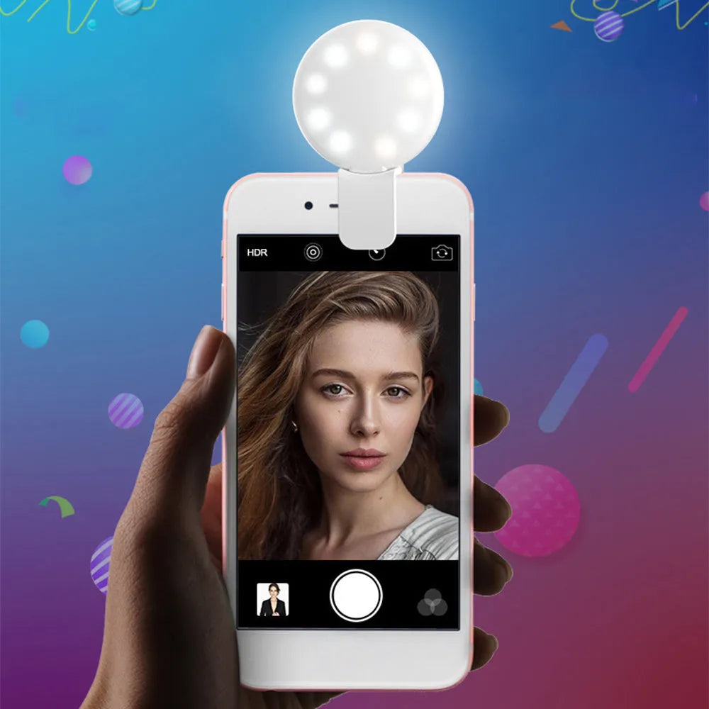 Mini clip-on selfie fill light for mobile phone in white, pink, blue, or black colour options