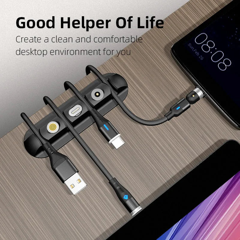 Black soft plastic desktop cable organiser with magnetic clips for charging cables.