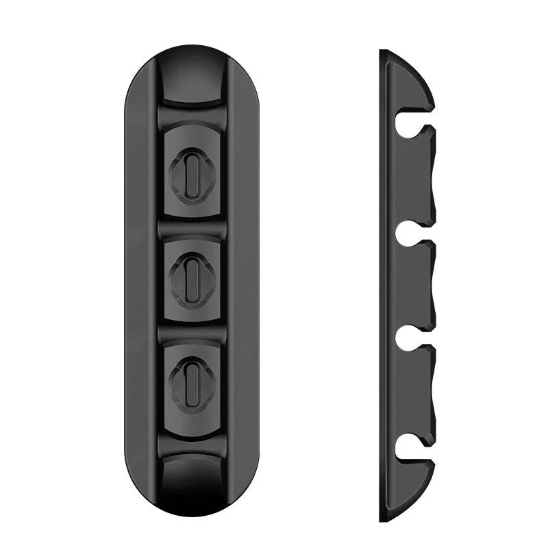 Black soft plastic desktop cable organiser with magnetic clips for charging cables.