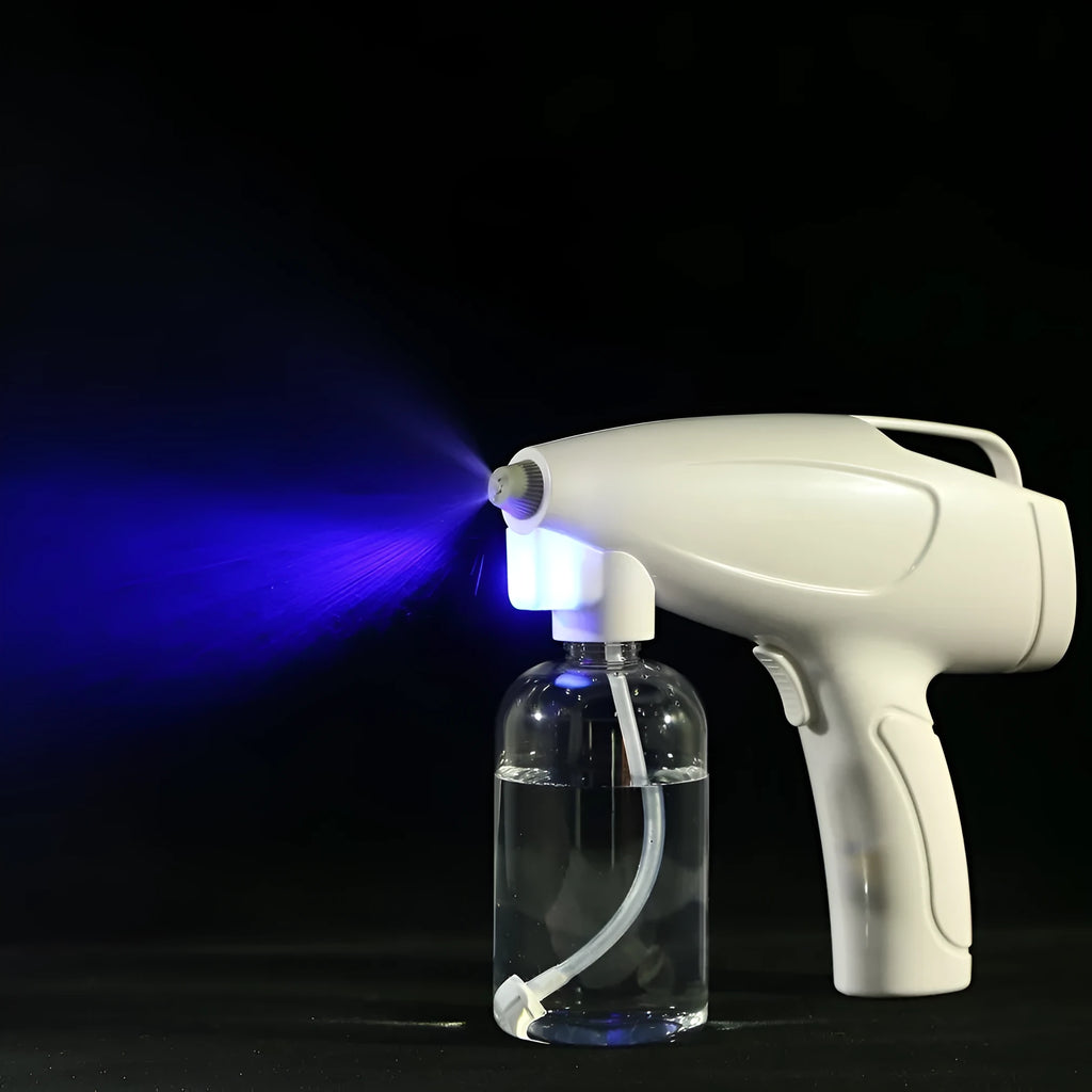 White handheld wireless electric spray gun for disinfection on a plain background.
