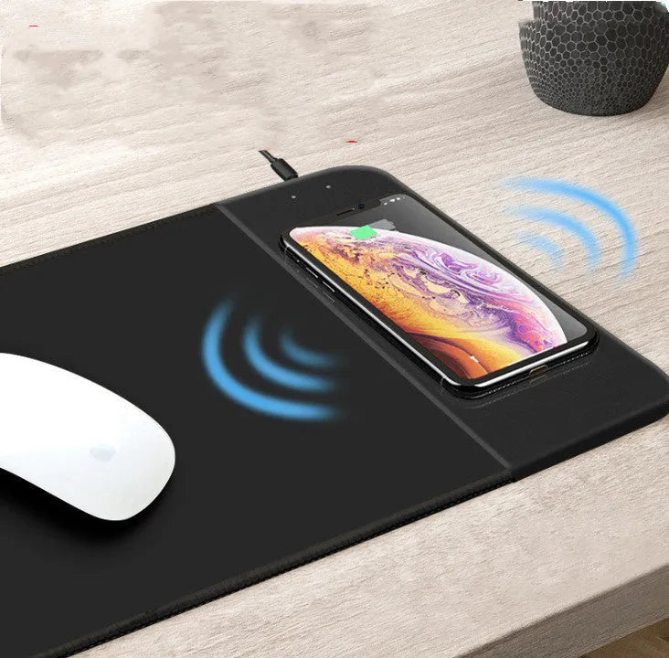 Black wireless charging mouse pad with RGB lighting and cartoon design measuring 298x215mm