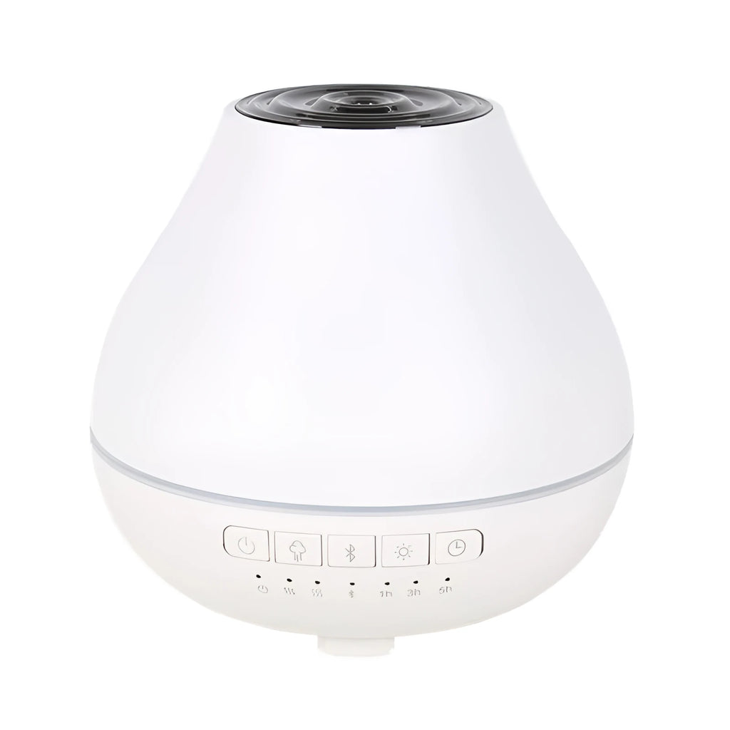 Round white Bluetooth humidifier and aroma diffuser with night light on a wooden surface.