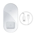 Baseus Minimalist 2-in-1 Wireless Charger Pro in black, charging an iPhone and AirPods.