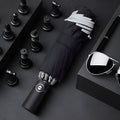 Automatic reverse folding umbrella with 58 cm diameter canopy in black colour showing folded and extended positions