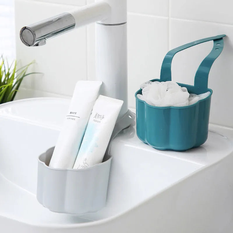 Dark blue plastic sink drain basket with Nordic design on a kitchen counter.