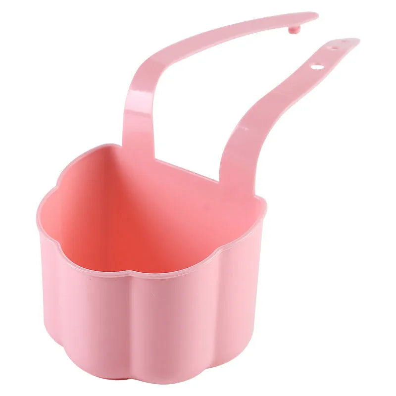 Dark blue plastic sink drain basket with Nordic design on a kitchen counter.
