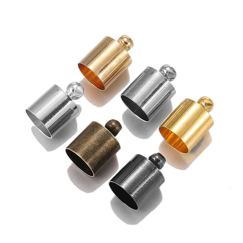 Assortment of electroplated copper weight caps in gold, silver, and bronze finishes for jewellery making.