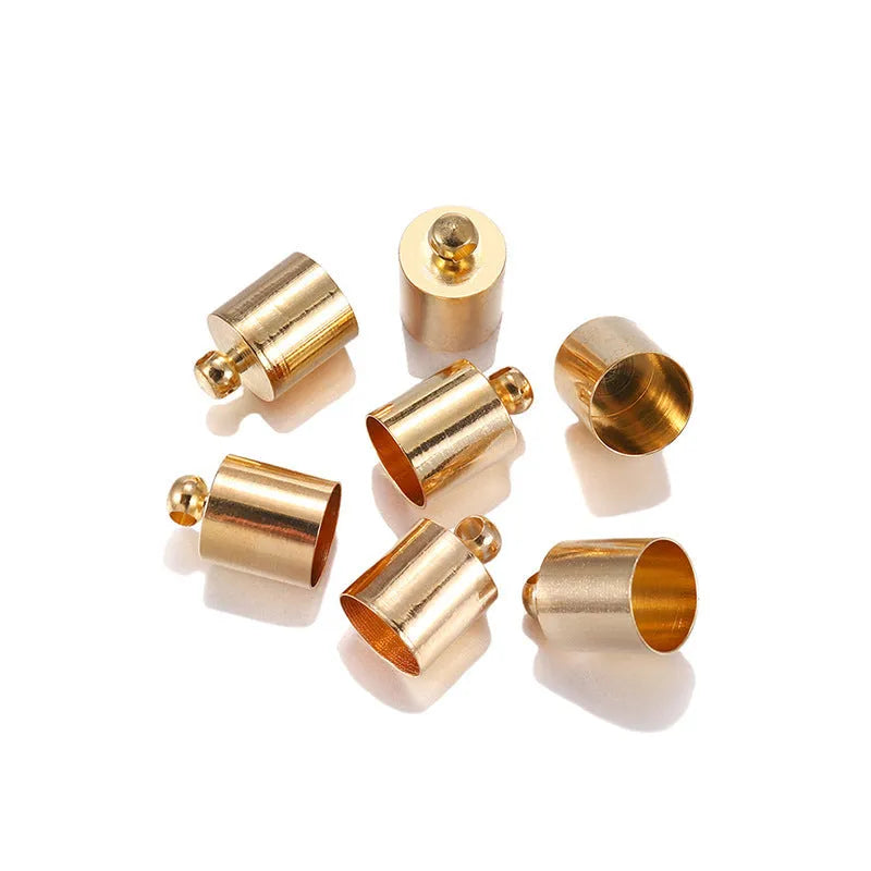 Assortment of electroplated copper weight caps in gold, silver, and bronze finishes for jewellery making.