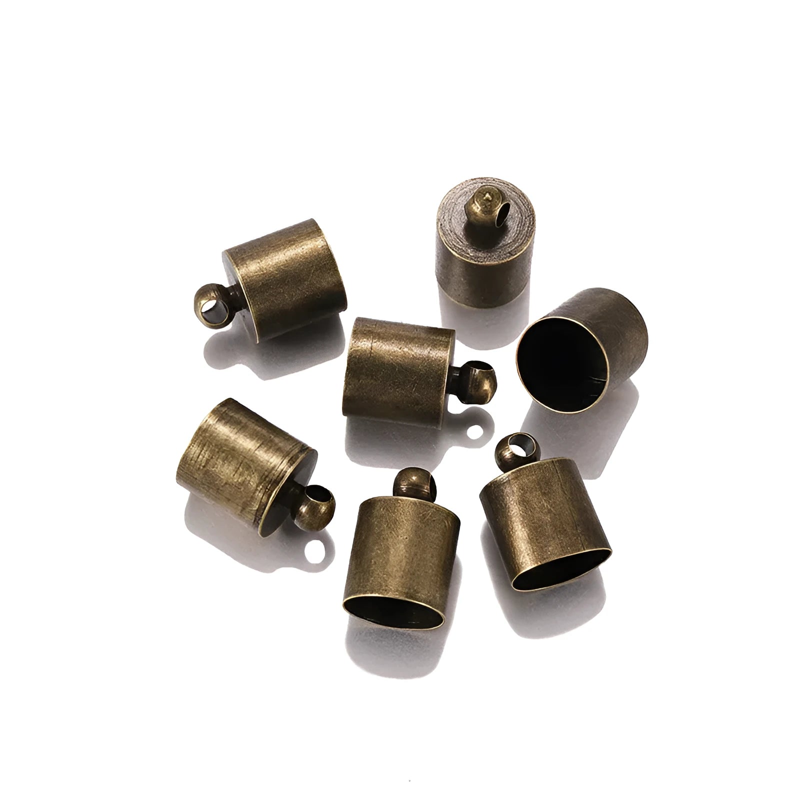 Assortment of electroplated copper weight caps in gold, silver, and bronze finishes for jewellery making.