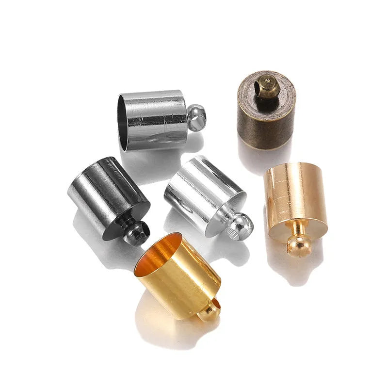 Assortment of electroplated copper weight caps in gold, silver, and bronze finishes for jewellery making.