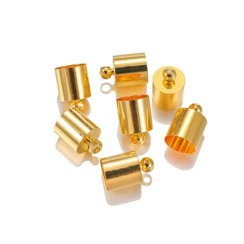 Assortment of electroplated copper weight caps in gold, silver, and bronze finishes for jewellery making.