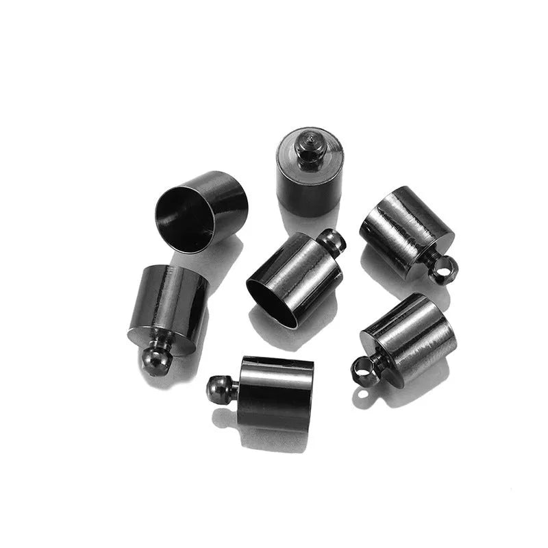 Assortment of electroplated copper weight caps in gold, silver, and bronze finishes for jewellery making.