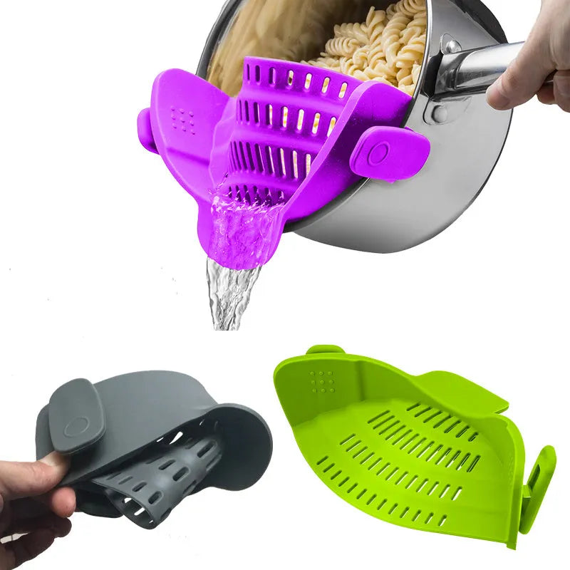 Silicone clip-on funnel strainer attached to kitchen pot for draining liquids