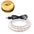 White flexible USB LED light strip showing SMD5050 LEDs, coiled next to its USB plug.