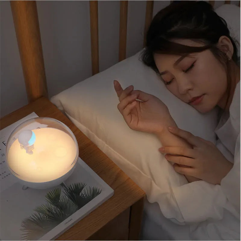 USB-powered cartoon LED night light with modern design showing white or blue light options