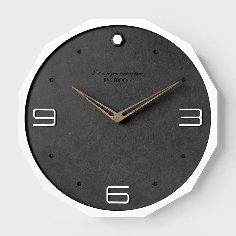 12-inch round minimalist wall clock with Geralt-style perforated design in four colour options.