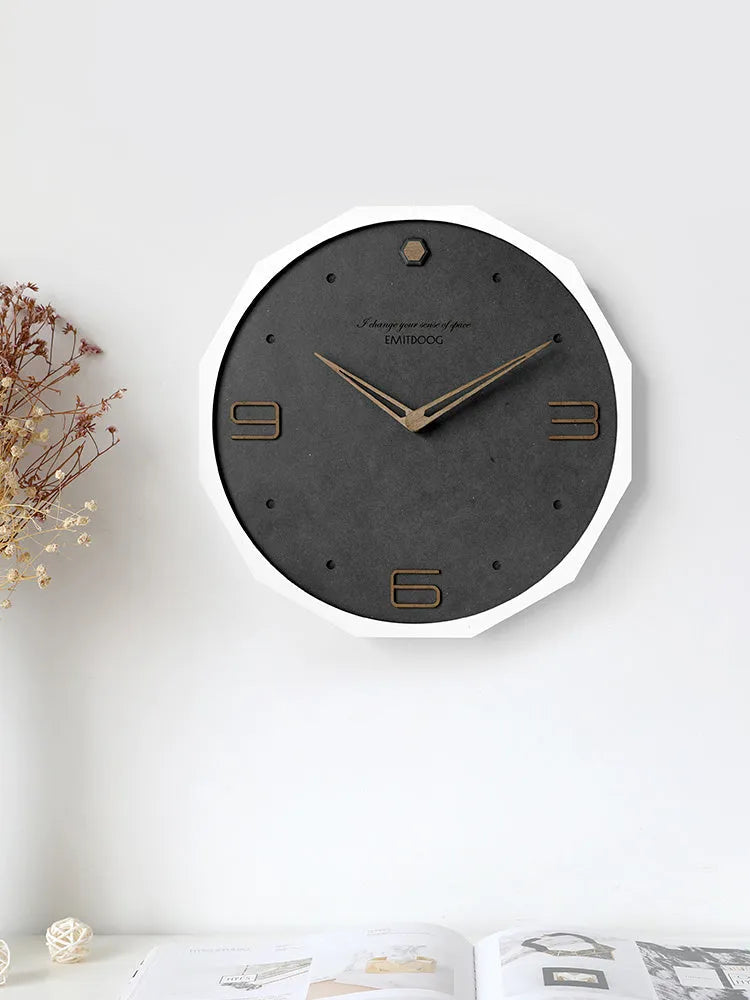 12-inch round minimalist wall clock with Geralt-style perforated design in four colour options.